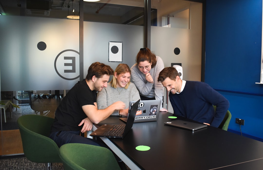 people-sitting-on-chair-in-front-of-laptop-computers-rmilc1piwm0